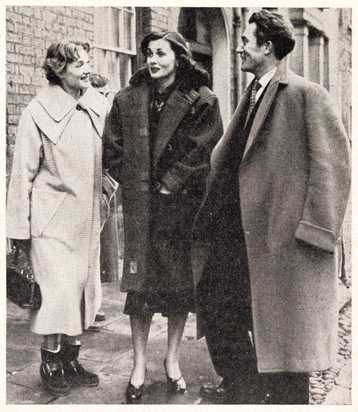 Two women and a man, apparently film actors, stand on the pavement ref. D/EX2686/5