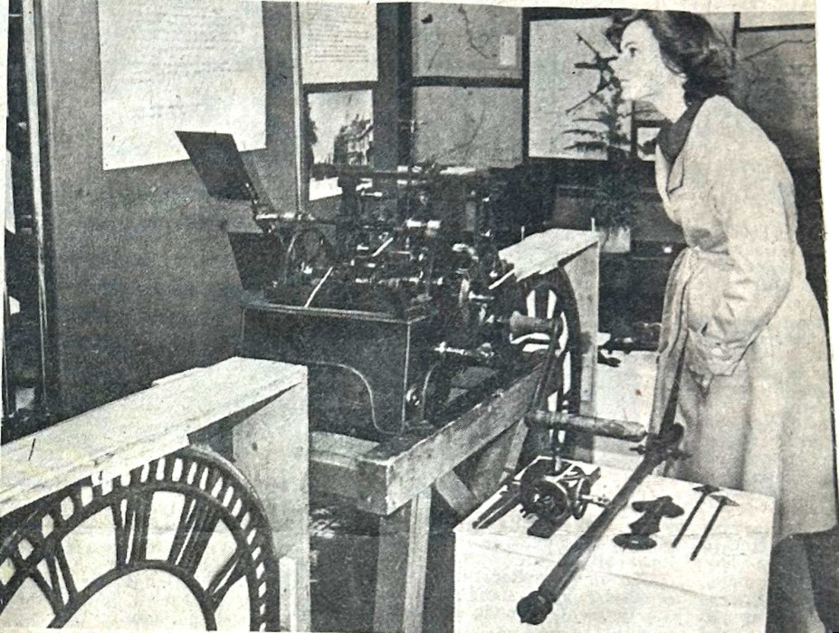 A woman looks at parts of the Fielden Clock on display, Bracknell Times 21 December 1978