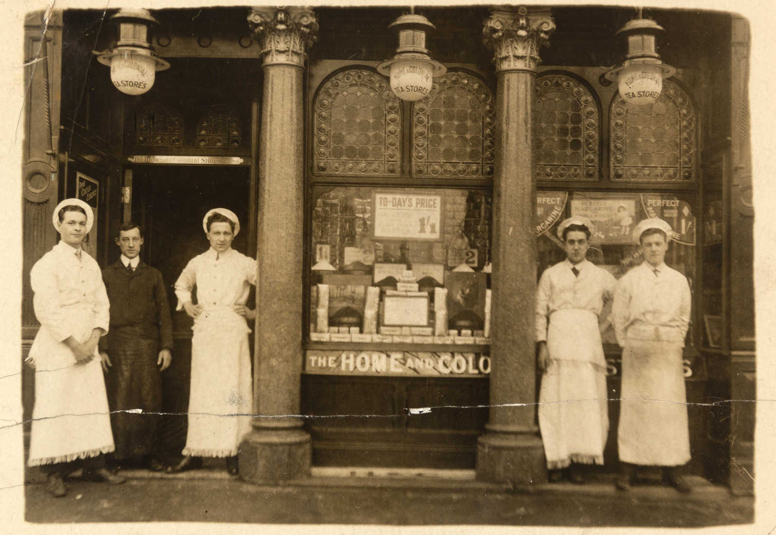 Staff stand outside the Home and Colonial Stores London Road, Reading 1913 ref. D/EX2407/6/3